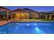 A resort-style backyard with a pool and covered patio at 22262 E Cherrywood Ct, Queen Creek, AZ 85142