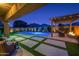 Spacious backyard with artificial turf, pool, and outdoor seating area at 22262 E Cherrywood Ct, Queen Creek, AZ 85142