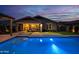 Backyard with pool, putting green, fire pit, and ample space for outdoor activities and entertaining at 22262 E Cherrywood Ct, Queen Creek, AZ 85142