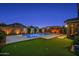 Beautiful backyard showcasing a pool, pergola, and artificial turf at 22262 E Cherrywood Ct, Queen Creek, AZ 85142