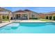 Inviting backyard pool and covered patio, perfect for relaxing and outdoor enjoyment at 22262 E Cherrywood Ct, Queen Creek, AZ 85142