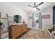 Bedroom with wood floors, ceiling fan, and crib at 22262 E Cherrywood Ct, Queen Creek, AZ 85142