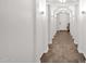 Long hallway features arched ceilings and stylish lighting at 22262 E Cherrywood Ct, Queen Creek, AZ 85142