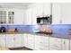 Updated kitchen features white cabinets, granite countertops, and stainless steel appliances at 22262 E Cherrywood Ct, Queen Creek, AZ 85142
