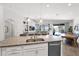 Open concept kitchen with granite countertop, stainless steel appliances, sink and breakfast nook with plenty of natural light at 22262 E Cherrywood Ct, Queen Creek, AZ 85142
