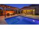 Backyard with pool, outdoor seating, and fire feature at 22262 E Cherrywood Ct, Queen Creek, AZ 85142