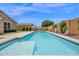 Sparkling swimming pool in a well-maintained backyard with lush landscaping at 22262 E Cherrywood Ct, Queen Creek, AZ 85142
