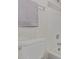Bright bathroom features a white toilet, tub, and tiled shower at 2301 E University Dr # 233, Mesa, AZ 85213