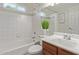 Bathroom features vanity, toilet, tub and tiled shower with leafy decoration at 2301 E University Dr # 233, Mesa, AZ 85213