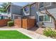 Charming two-story home with a brick wall, wooden gate and freshly manicured lawn at 2301 E University Dr # 233, Mesa, AZ 85213