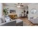 Stylish living room with modern decor, a sectional sofa, and an open dining area at 2301 E University Dr # 233, Mesa, AZ 85213