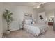 Comfortable main bedroom with natural light, ceiling fan, tasteful decor, and neutral colors at 2301 E University Dr # 233, Mesa, AZ 85213