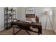 Office space featuring desk with built-in storage, shelving, and natural light at 2301 E University Dr # 233, Mesa, AZ 85213