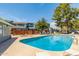 An inviting community pool with lounge chairs offers residents an excellent outdoor space to relax and enjoy the weather at 2301 E University Dr # 233, Mesa, AZ 85213