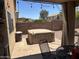 A cozy back patio features a hot tub and string lights, perfect for relaxing evenings at 2411 W Lucia Dr, Phoenix, AZ 85085