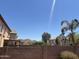 The backyard features desert landscaping, privacy walls, mountain views, and mature palm trees at 2411 W Lucia Dr, Phoenix, AZ 85085