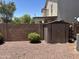 This backyard offers ample storage with a storage shed and is equipped with desert landscaping at 2411 W Lucia Dr, Phoenix, AZ 85085