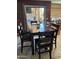 Dining room area with table, chairs and view of backyard and patio area at 2411 W Lucia Dr, Phoenix, AZ 85085