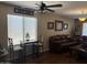 Living room with wood floors, brown leather couch, and decor at 2411 W Lucia Dr, Phoenix, AZ 85085