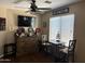 Living room with wood floors, brown leather couch, bar and decor at 2411 W Lucia Dr, Phoenix, AZ 85085