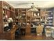 Spacious home office with built-in shelving, wooden desk, and ample storage space for a productive workspace at 2411 W Lucia Dr, Phoenix, AZ 85085