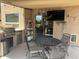 Entertain outdoors on this covered patio with a grill, storage, and a flatscreen television at 2411 W Lucia Dr, Phoenix, AZ 85085