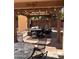 Enjoy the covered patio area with cozy seating, pavers, and string lights to relax outdoors at 2411 W Lucia Dr, Phoenix, AZ 85085
