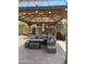 Inviting outdoor patio area with comfortable seating, a gazebo, and various grilling options for entertaining at 2411 W Lucia Dr, Phoenix, AZ 85085