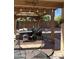 Enjoy the covered patio area with cozy seating, pavers, and string lights to relax outdoors at 2411 W Lucia Dr, Phoenix, AZ 85085