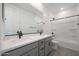 Bathroom featuring double sinks with sleek fixtures and a modern shower/tub, blending style and functionality at 24232 W Agora Ln, Buckeye, AZ 85326