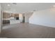 Open-concept living area showcases modern tile flooring and a seamless connection to the kitchen at 24232 W Agora Ln, Buckeye, AZ 85326