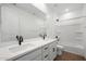 This bathroom has double sinks, granite countertops, and a tiled shower at 24249 W Agora Ln, Buckeye, AZ 85326