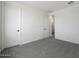 This bedroom features neutral walls, carpet flooring and modern doors at 24249 W Agora Ln, Buckeye, AZ 85326