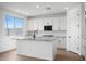 Bright kitchen with white cabinets, granite counters, stainless appliances, island with sink, and tile backsplash at 24249 W Agora Ln, Buckeye, AZ 85326