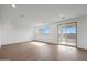 Bright living room with tile floors, a sliding glass door and a large window for ample natural light at 24249 W Agora Ln, Buckeye, AZ 85326