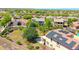 Aerial view of a neighborhood showcasing solar panels, mature trees, and spacious backyards at 2726 S 160Th Ave, Goodyear, AZ 85338