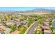 A broad aerial shot showcases the neighborhood with distant mountain views, emphasizing the home's location and community at 2726 S 160Th Ave, Goodyear, AZ 85338