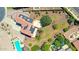 Aerial view of a home with solar panels, a red tile roof, desert landscaping, and a pool at 2726 S 160Th Ave, Goodyear, AZ 85338