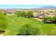 Neighborhood overhead with large green space, mountain views, and homes with solar panels in this desirable community at 2726 S 160Th Ave, Goodyear, AZ 85338