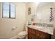 Bathroom with vanity, granite countertop, circular mirror, and toilet at 2726 S 160Th Ave, Goodyear, AZ 85338