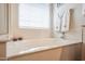 Close-up of the large soaking tub with towels and toiletries in this bright bathroom at 2726 S 160Th Ave, Goodyear, AZ 85338