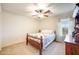 Cozy bedroom features a charming window with lots of natural light, carpet floors and a ceiling fan at 2726 S 160Th Ave, Goodyear, AZ 85338