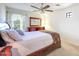 Comfortable bedroom featuring large wood dresser and decorative mirror next to bed at 2726 S 160Th Ave, Goodyear, AZ 85338