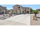Charming two-story home with a spacious driveway and desert landscaping, perfect for curb appeal at 2726 S 160Th Ave, Goodyear, AZ 85338