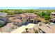 Stunning two-story home showcasing a red tile roof, solar panels, desert landscaping, and a long driveway at 2726 S 160Th Ave, Goodyear, AZ 85338