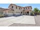 Beautiful two-story home featuring a three-car garage and a meticulously kept front yard at 2726 S 160Th Ave, Goodyear, AZ 85338