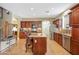 Modern kitchen with stainless steel appliances, granite counters, and an island with barstool seating at 2726 S 160Th Ave, Goodyear, AZ 85338