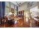 Spacious living area with hardwood floors, fireplace, large windows and custom built in shelves at 2726 S 160Th Ave, Goodyear, AZ 85338