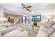 Bright living room features a fan, carpet floors and stairway to the bedrooms at 2726 S 160Th Ave, Goodyear, AZ 85338