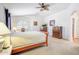 Comfortable main bedroom featuring vaulted ceiling, ceiling fan, and light neutral colored walls at 2726 S 160Th Ave, Goodyear, AZ 85338